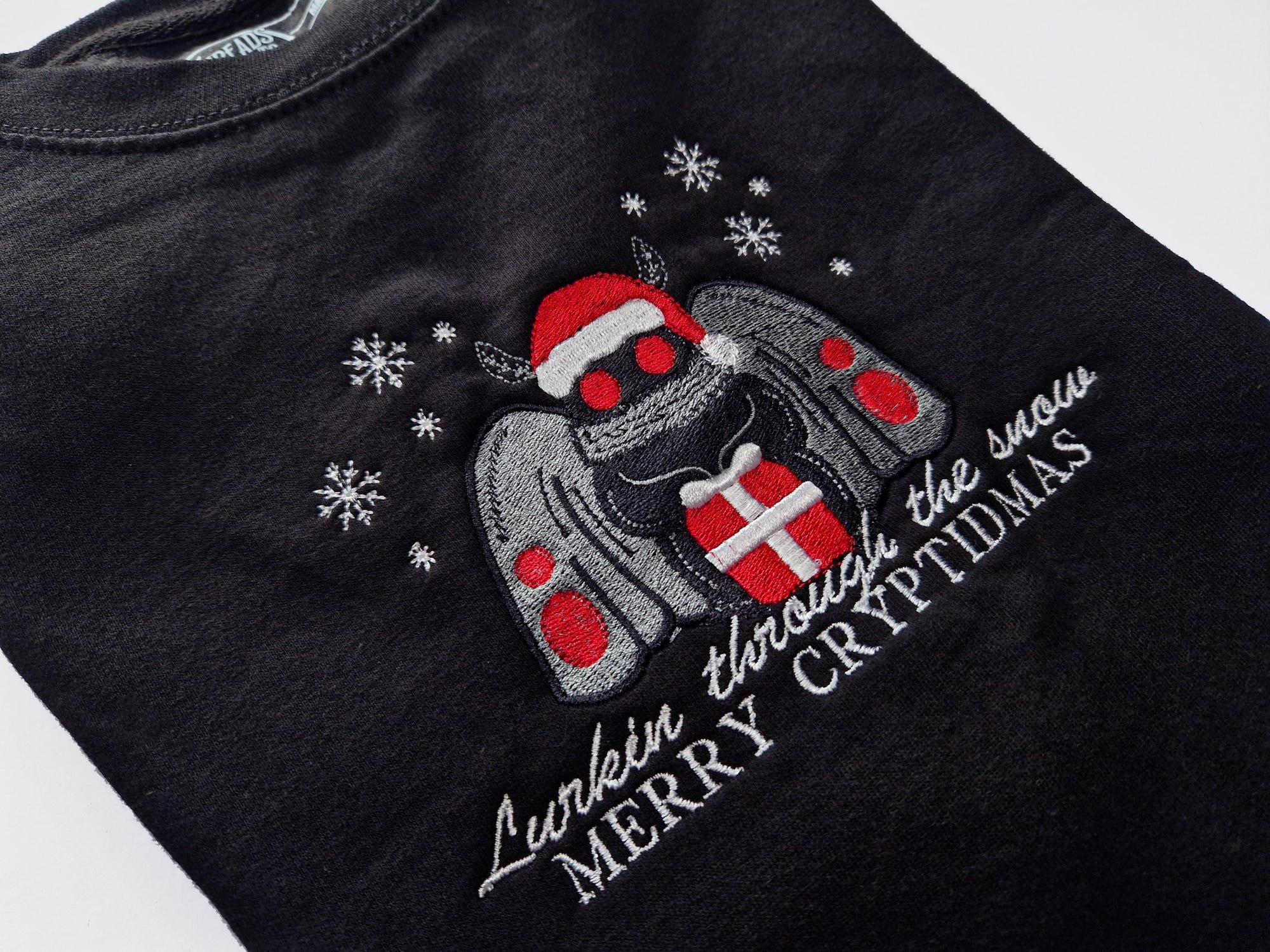 il_2000xN.6433099230_44m6-1.jpg Merry Cryptidmas Mothman Christmas Sweatshirt