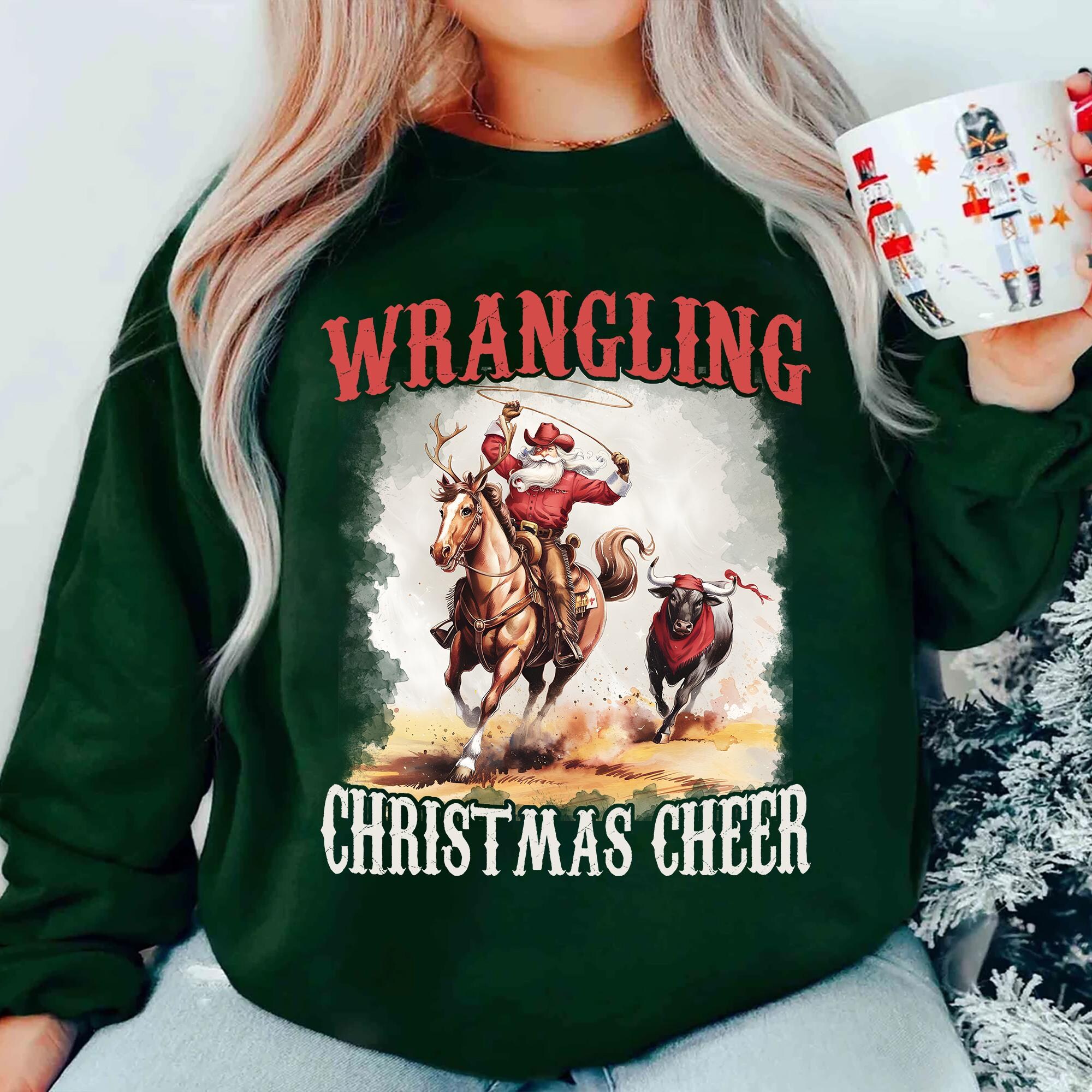 il_2000xN.7267298440_c6j7.jpg Wrangling Christmas Cheer Sweatshirt, estern Christmas Shirt, Cowboy Santa Shirt,Funny Christmas Shirt,Holiday Christmas Sweatshirt,Xmas Tee