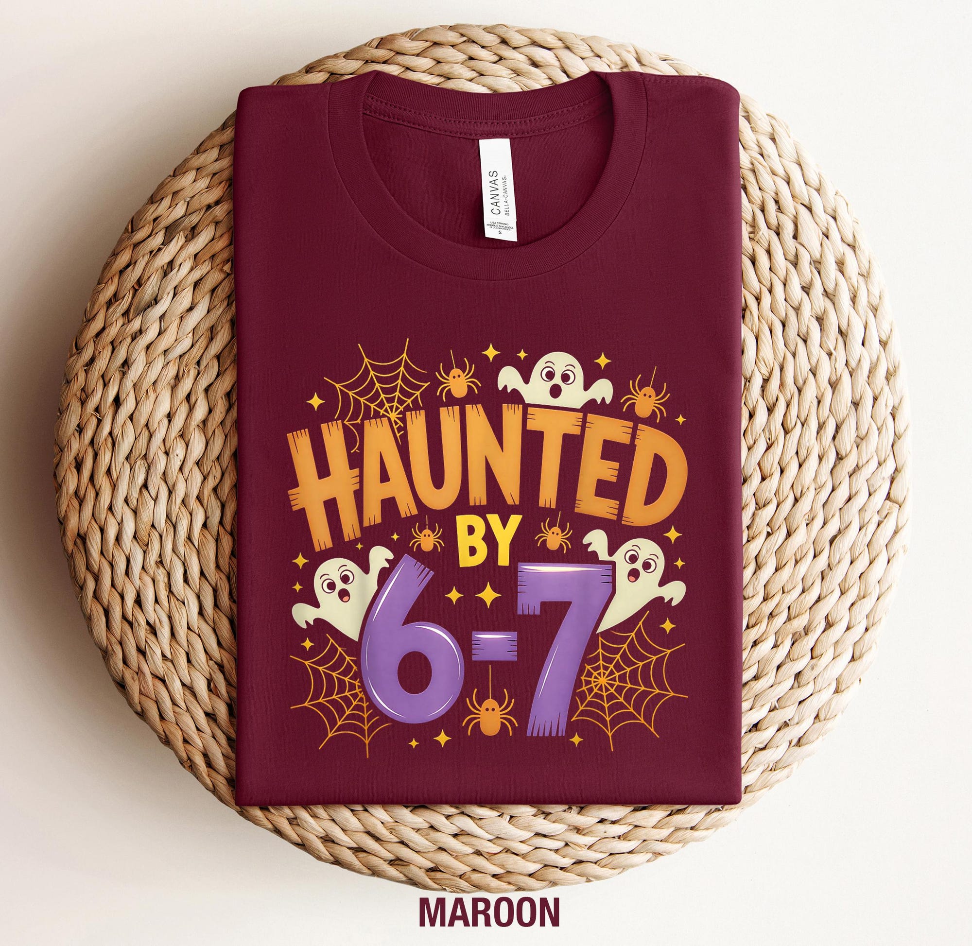 il_2000xN.7288774111_lgkb.jpg Haunted By 6-7 Halloween Shirt: Spooky Viral Meme Tee